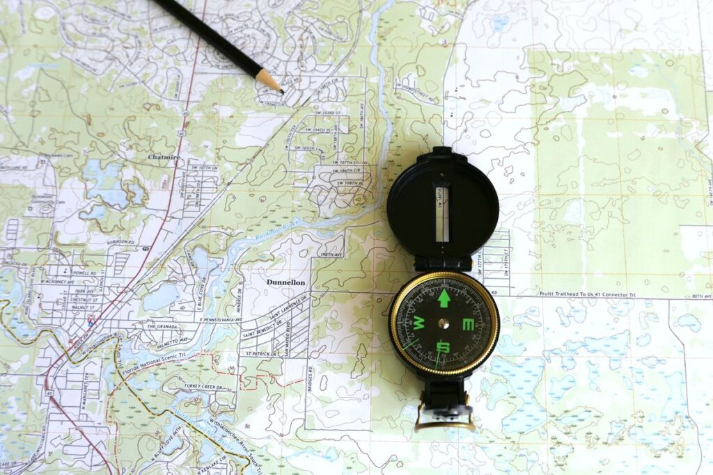 Detailed topographic survey map with compass and pencil